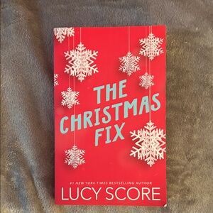 The Christmas Fix by Lucy Score - Red Paperback Holiday Novel
